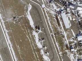 This satellite image from Planet Labs PBC shows a Beriev A-50 early warning aircraft, centre, at Machulishchy Air Base near Minsk, Belarus, Feb. 19, 2023.