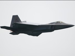 A United States Air Force F-22 Raptor fighter jet performs an aerial display during the Singapore Airshow media preview on Feb. 9, 2020 in Singapore.
