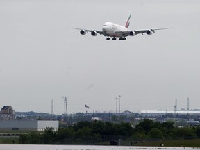 An Emirates A380 aircraft gets ready to land on the runway at Pearson International Airport on Monday, June 1, 2009. Pearson airport plans to cap the number of flights into and out of Canada's largest air hub at peak travel times.