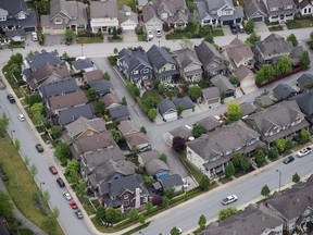 New Statistics Canada data shows investors made up almost one third of home owners in some provinces in 2020. Houses and townhouses are seen in an aerial view, in Langley, B.C., May 16, 2018.