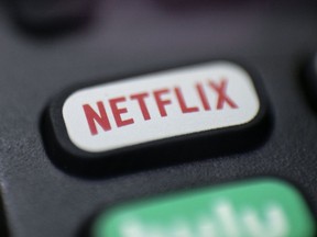 This Aug. 13, 2020 file photo shows a logo for Netflix on a remote control in Portland, Ore.