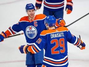 Edmonton Oilers Leon Draisaitl (29) celebrates his goal with teammate Connor McDavid (97) against the Tampa Bay Lightning during first period NHL action on Thursday, Jan. 19, 2023 in Edmonton.