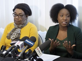 Lawyer Marie-Livia Beauge, right, speaks to the media as Mireille Bence, whose son Jean-Rene Jr. Olivier was shot shot dead by police in 2021, looks on during a news conference in Repentigny on Tuesday, Feb. 28, 2023. Bence is suing the City of Repentigny for wrongful death.