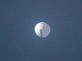 This handout photo from Chase Doak taken on Feb. 1, 2023 and released on Feb. 2 shows a suspected Chinese spy balloon in the sky over Billings, Montana.