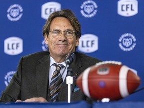 Quebecor CEO Pierre Karl Péladeau smiles after being introduced as new owner of the Montreal Alouettes by Canadian Football League commissioner Randy Ambrosie at a press conference in Montreal Friday March 10, 2023.