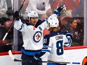 Mark Scheifele (55) celebrates his game winning overtime goal with Kyle Connor (81) of the Winnipeg Jets against the Florida Panthers at the FLA Live Arena on March 11, 2023 in Sunrise, Fla.