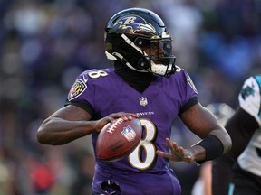 Quarterback Lamar Jackson of the Baltimore Ravens drops back to pass against the Carolina Panthers at M&T Bank Stadium on November 20, 2022 in Baltimore, Maryland.