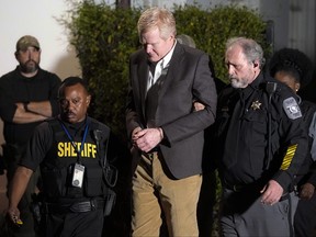 Alex Murdaugh is led outside the Colleton County Courthouse by sheriff's deputies after being convicted of two counts of murder Thursday, March 2, 2023, in Walterboro, S.C.