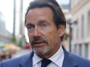 Pierre Karl Peladeau talks with reporters in Ottawa on Tuesday, May 31, 2022. Peladeau is the new owner of the Montreal Alouettes.