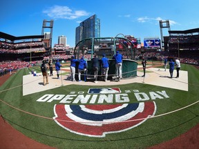 Members of the Toronto Blue Jays take batting practice prior to a game against the St. Louis Cardinals on Opening Day at Busch Stadium.