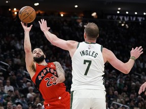Raptors' Fred VanVleet (23) is fouled as he shoots against Milwaukee Bucks' Joe Ingles during the first half on Sunday, March 19, 2023, in Milwaukee.