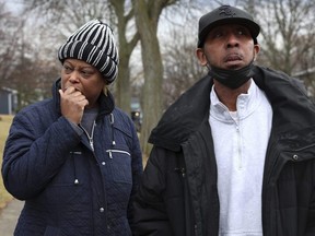 Melinda and Anthony Taylor stand outside their neighbour's home in Bolingbrook, Ill., on Monday, March 6, 2023, where three people were fatally shot, and another person was wounded Sunday night.