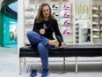 Finance Minister Chrystia Freeland, following a decades-long tradition, tries on a pair of shoes purchased a day ahead of her delivering the 2023 Budget, at fashion retailer Simons in Ottawa, Monday, March 27, 2023.