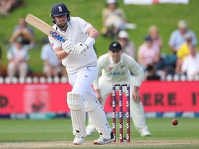 England's Ollie Robinson plays a shot as New Zealand's wicketkeeper Tom Blundell looks on during day five of the second cricket test match between New Zealand and England at the Basin Reserve in Wellington on February 28, 2023.