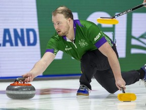 Prince Edward Island vice-skip Adam Cocks releases a rock during an 8-7 win against Ontario in the Tim Hortons Brier at Budweiser Gardens in London on Monday, March 6, 2023. (Derek Ruttan/The London Free Press)