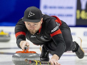 Ontario skip Mike McEwen sends a rock down the sheet during a 10-7 win over Yukon at The Brier competition at Budweiser Gardens in London, Ont. on Tuesday March 7, 2023. (Derek Ruttan/The London Free Press)