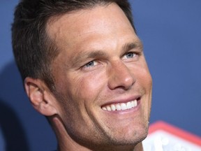 In this file photo taken on January 31, 2023, NFL star Tom Brady arrives for the Los Angeles premiere screening of "80 For Brady" at the Regency Village Theatre in Los Angeles.