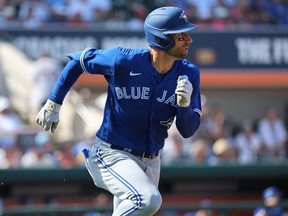 Mar 4, 2023; Lakeland, Florida, USA; Toronto Blue Jays outfielder Kevin Kiermaier hits a 2 RBI triple during the fourth inning against the Detroit Tigers at Publix Field at Joker Marchant Stadium.