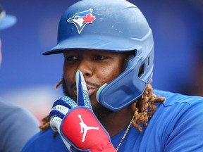 Mar 18, 2023; Dunedin, Florida, USA; Toronto Blue Jays first baseman Vladimir Guerrero Jr. reacts after hitting a home run against the New York Yankees in the first inning during spring training at TD Ballpark.