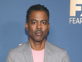 In this file photo taken on Jan. 9, 2020 Chris Rock arrives for the FX Network Winter TCA 2020 press tour at Langham Huntington Hotel in Pasadena, California