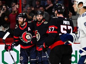 Senators forward Derick Brassard, middle, celebrates a goal against the Lightning during the second period with Claude Giroux, left, and Shane Pinto.