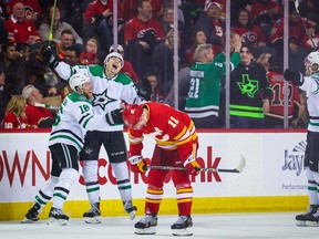 Mar 18, 2023; Calgary, Alberta, CAN; Dallas Stars left wing Jason Robertson (21) celebrates his goal with teammates against the Calgary Flames during the overtime period at Scotiabank Saddledome. Mandatory Credit: Sergei Belski-USA TODAY Sports
