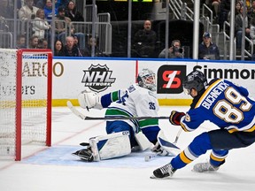 St. Louis Blues left wing Pavel Buchnevich (89) shoots and scores against Vancouver Canucks goaltender Thatcher Demko (35) during the second period at Enterprise Center.