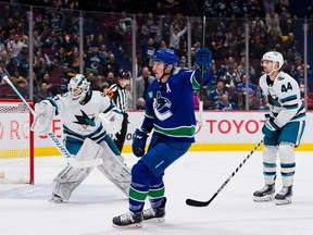 San Jose Sharks defenceman Marc-Edouard Vlasic (44) and goalie James Reimer (47) watch as Vancouver Canucks forward J.T. Miller (9) celebrates his goal in the first period at Rogers Arena.