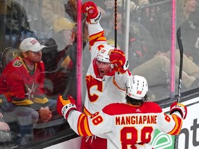 Mar 16, 2023; Las Vegas, Nevada, USA; Calgary Flames right wing Tyler Toffoli (73) celebrates with Calgary Flames left wing Andrew Mangiapane (88) after scoring a goal against the Vegas Golden Knights during the third period at T-Mobile Arena. Mandatory Credit: Stephen R. Sylvanie-USA TODAY Sports