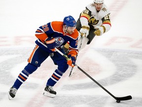 The Edmonton Oilers' Leon Draisaitl (29) battles the Vegas Golden Knights' Brett Howden (21) during first period NHL action at Rogers Place in Edmonton, Saturday March 25, 2023. Photo by David Bloom