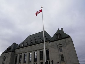 The flag of the Supreme Court of Canada flies on the east flagpole in Ottawa, on Monday, Nov. 28, 2022.