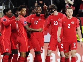 Canada forward Cyle Larin (17) celebrates his goal against Honduras with teammates during first half CONCACAF Nations League soccer action in Toronto on Tuesday, March 28, 2023.
