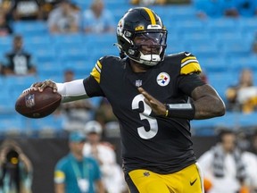 Dwayne Haskins of the Pittsburgh Steelers looks to pass against the Carolina Panthers during the first half of an NFL preseason game at Bank of America Stadium on August 27, 2021 in Charlotte, North Carolina.
