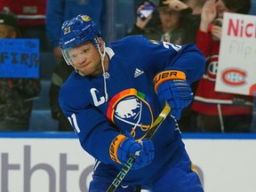 Kyle Okposo of the Buffalo Sabres warms up wearing an NHL Pride jersey before the game against the Montreal Canadiens at KeyBank Center on March 27, 2023 in Buffalo, New York.