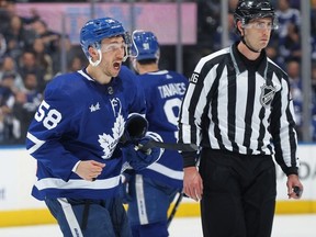 Michael Bunting of the Toronto Maple Leafs reacts to being ejected from the game against the Tampa Bay Lightning during Game One of the First Round of the 2023 Stanley Cup Playoffs at Scotiabank Arena on April 18, 2023 in Toronto, Ontario, Canada.