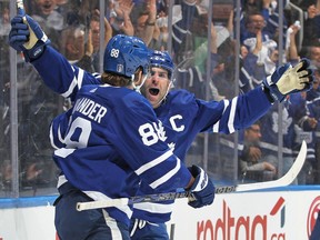 Leafs captain John Tavares celebrates a goal with William Nylander in Game 2 of their first-round playoff series against the Lightning Thursday night in Toronto.