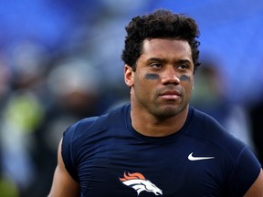Quarterback Russell Wilson of the Denver Broncos runs off the field following the Broncos 10-9 loss to the Baltimore Ravens at M&T Bank Stadium on December 04, 2022 in Baltimore, Maryland.