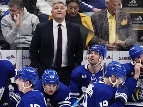 Maple Leafs head coach Sheldon Keefe looks on from the bench during the third period against the Tampa Bay Lightning in Toronto, on Tuesday, April 18, 2023.
