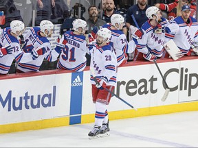 New York Rangers left wing Chris Kreider celebrates his goal with teammates during the second period in game two of the first round of the 2023 Stanley Cup Playoffs against the New Jersey Devils at Prudential Center in Newark, N.J., April 20, 2023.