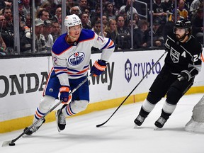 Edmonton Oilers centre Nick Bjugstad (72) moves the puck against Los Angeles Kings centre Phillip Danault (24) in Game 4 of the first round of the Stanley Cup Playoffs on Sunday, April 23, 2023, at Crypto.com Arena in Los Angeles.