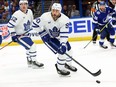 Maple Leafs centre Ryan O'Reilly skates with the puck against the Tampa Bay Lightning during the first period of Game 3 at Amalie Arena.