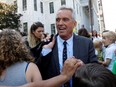 Attorney Robert F. Kennedy Jr. is surrounded by supporters as he departs New York State Supreme Court in Albany, N.Y., Aug. 14, 2019.