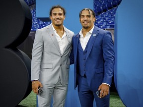 Brothers in suits together last July at Big Ten football media day in Chicago, Sydney on the left, Chase on the right.