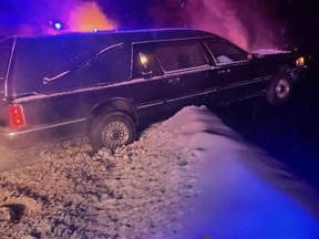 a dead body in a hearse helped stop the car from plunging over a cliff, according to reports.