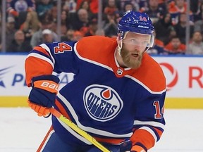 Defenceman Mattias Ekholm of the Edmonton Oilers skates with the puck in the second period against the San Jose Sharks on March 20, 2023 at Rogers Place in Edmonton.