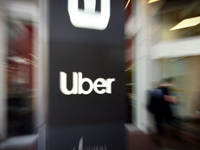 In this file photo taken on May 08, 2019 an Uber logo is seen outside the company's headquarters in San Francisco, California.