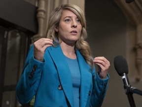 Foreign Affairs Minister Mélanie Joly speaks with reporters as she heads to a meeting of cabinet on Parliament Hill, on Tuesday, April 25, 2023 in Ottawa. Foreign Affairs Minister Mélanie Joly is in Kenya to help inform Canada's response to the crisis in Sudan.