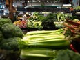 A woman shops for produce in Vancouver, on Wednesday, July 20, 2022.