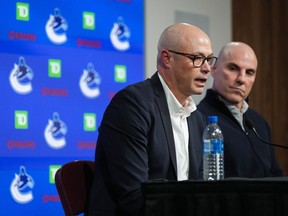 Vancouver Canucks general manager Patrik Allvin, front left, speaks as head coach Rick Tocchet listens during the NHL hockey team's end of season news conference, in Vancouver, on Monday, April 17, 2023.