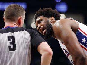 Joel Embiid of the Philadelphia 76ers reacts toward referee Nick Buchert against the Brooklyn Nets during the second half of Game 3 of the Eastern Conference First Round Playoffs at Barclays Center on April 20, 2023 in the Brooklyn borough of New York City.